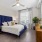 Second Bedroom with ceiling fan and oversized windows