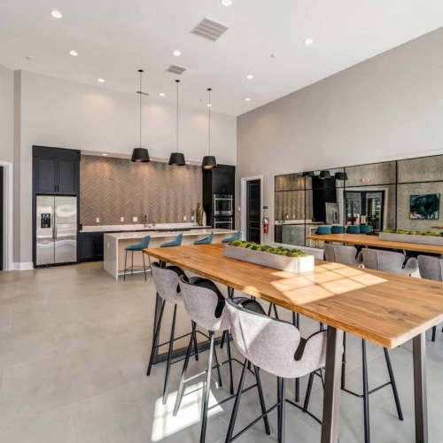 resident lounge with room for lounging on couches and tables for meals