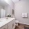 bathroom area with a sink and a stylish faucet, on wooden floors