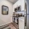 kitchen area on wooden floor with spacious counter-space and designer appliances