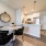 spacious, brightly lit dining room with easy access to the kitchen