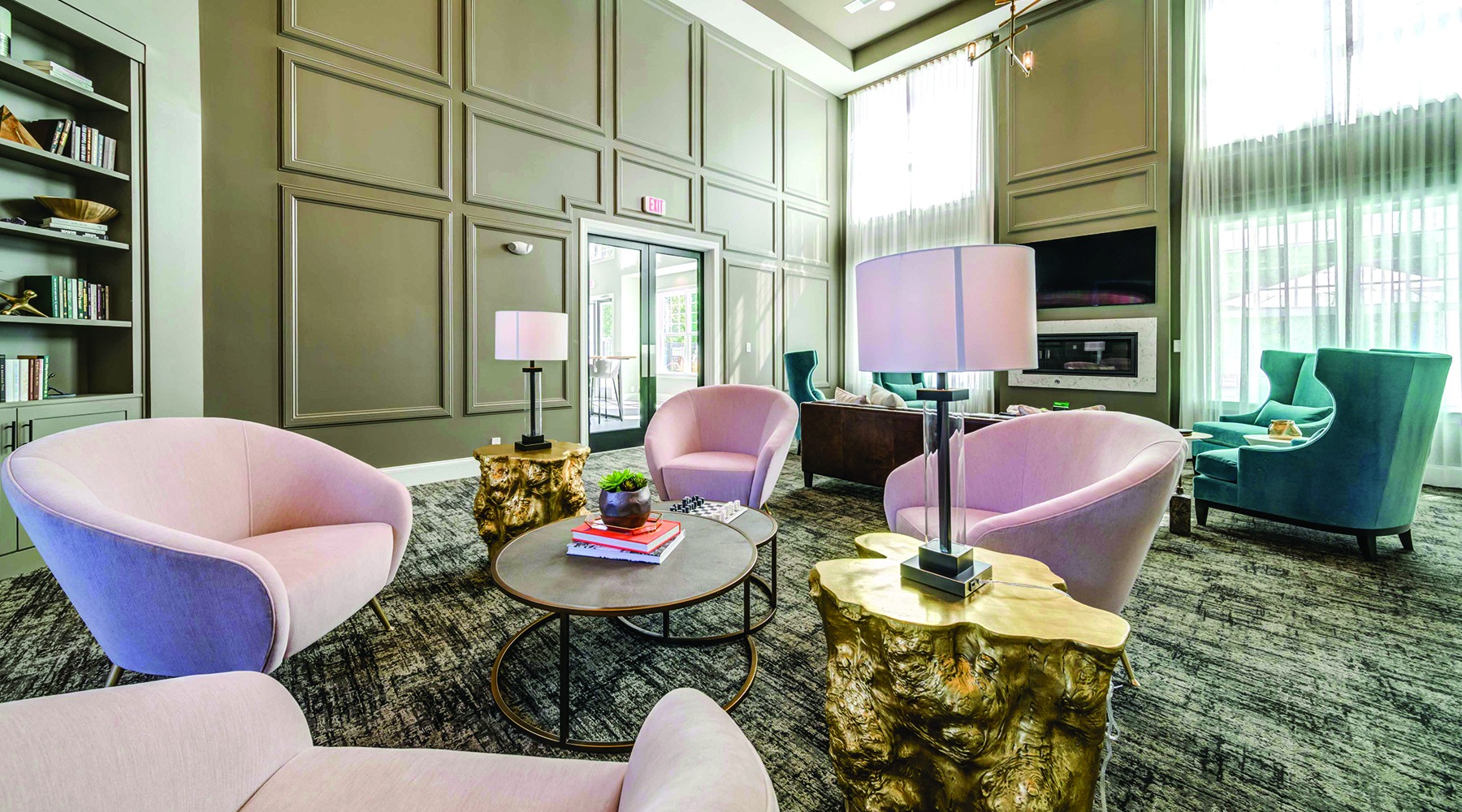 Spacious well lit resident lounge with comfortable chairs